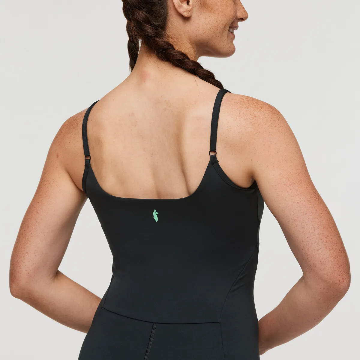 Cotopaxi Muevo bodysuit femme noir recyclé sport