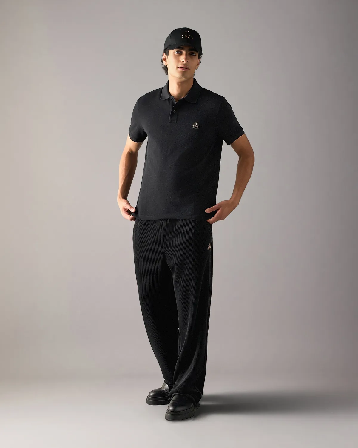Moose Knuckles Gold Series Everett polo noir détails dorés