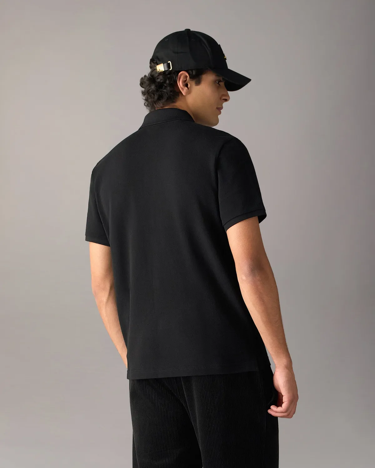 Moose Knuckles Gold Series Everett polo noir détails dorés